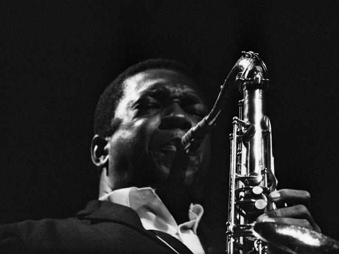 Photo of John Coltrane playing saxophone