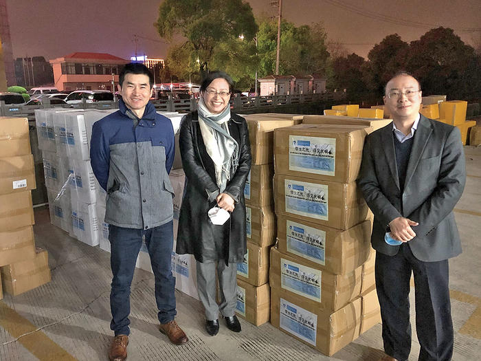 Jianfei Zhu, Yuan Wang, and Yimei Lu from the Columbia Alumni Association prepare a shipment of PPE in Shanghai to send to Columbia University Irving Medical Center