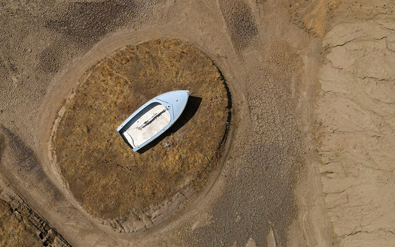 A boat on a dried up lake