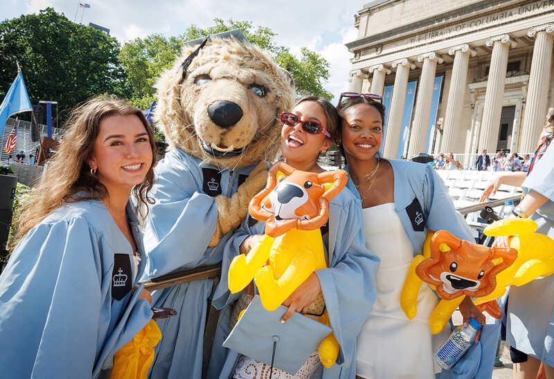 Columbia graduates with the Roar-ee mascot at 2026 commencement